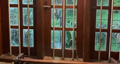 Bordering a large paddy field ( Non AC No WIFI - No Hot Water - No Room Service)