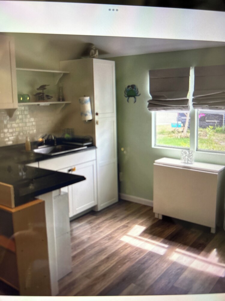 Cozy little cottage a mile away from beautiful hobe sound beach. Fenced