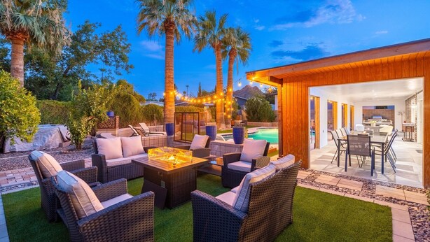 An outdoor patio with wicker furniture, a fire pit, and a pool area. - Luxury 4 Bed/4Bath! Private Pool & Mountain Views! (Phoenix)