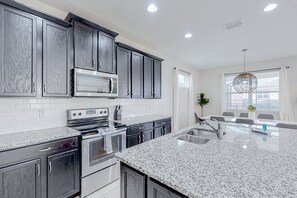 Fridge, microwave, oven, stovetop - Solara Joy | Disney-themed retreat in Kissimmee with stellar resort amenities (Kissimmee)