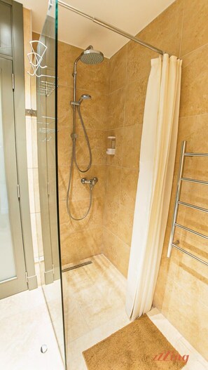 Shower, hair dryer, towels, shampoo