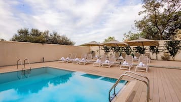 Outdoor pool, open 10:00 AM to 7:00 PM, pool umbrellas, sun loungers