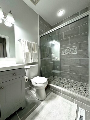 Shower, hair dryer, towels, soap