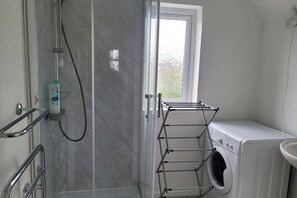 Shower, hair dryer, towels
