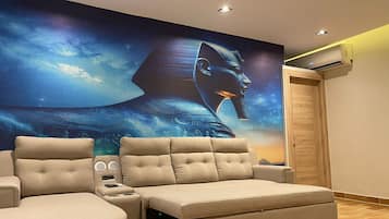 Luxury Suite, Jetted Tub, City View | Living room | 41-inch Smart TV with satellite channels