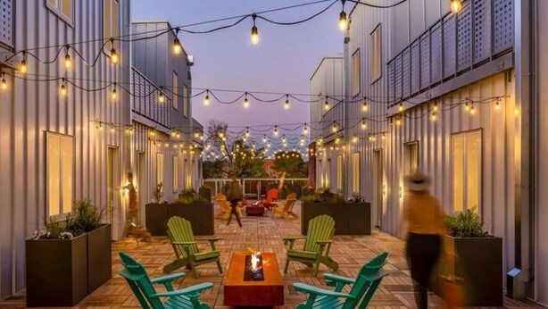 A courtyard with outdoor seating, string lights, and potted plants. - Jungle House: 2 Bed Condo w/parking & Patio (Denver)