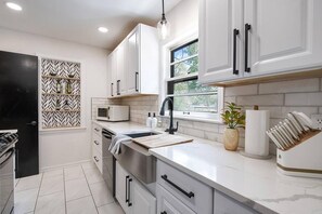 Fridge, microwave, oven, stovetop - Opulent Oasis - Spa! Fire Pit! 3 Kings! Pool Table! Kids Area! (Wichita)