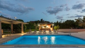 A swimming pool with lounge chairs and a covered seating area. - Vesna Branka in Pi an (Pican)