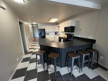 Fridge, microwave, oven, stovetop. Updated apartment on Main Street! Easy access to bars, restaurants, & shopping!