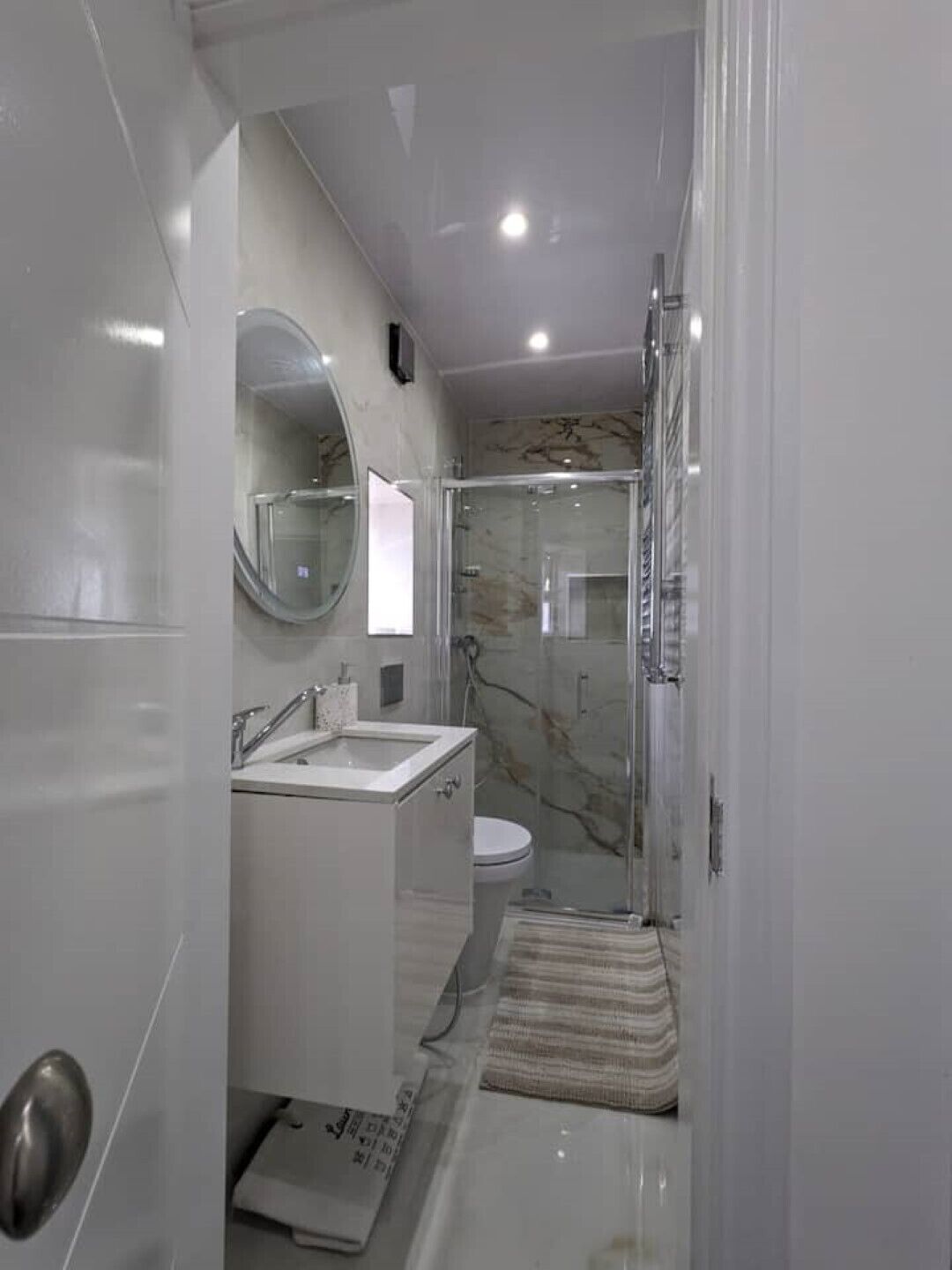 Shower, hair dryer, towels, toilet paper