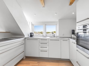 Fridge, oven, high chair, cookware/dishes/utensils
