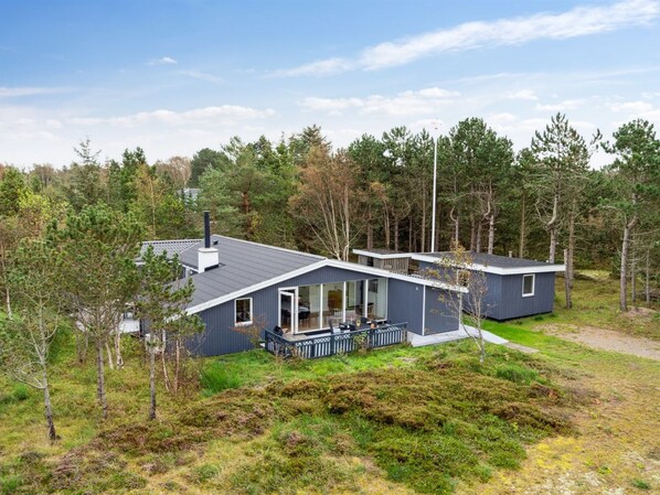 A modern two-story house with a balcony, surrounded by dense forest. - "Djuna" - 200m from the sea by Interhome (Læsø)