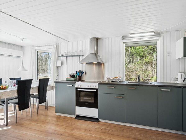 Fridge, oven, high chair, cookware/dishes/utensils