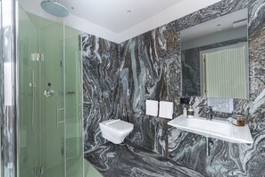 Shower, hair dryer, towels, shampoo