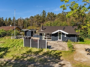 A residential property with a main house, a garage, and a fenced yard. - "Tishon" - 100m from the sea by Interhome (Læsø)