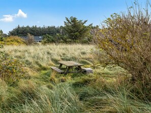 Sit and enjoy the peaceful surroundings at this serene outdoor space.