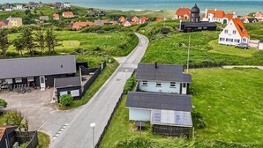 A coastal village with houses, a road, and a view of the sea. - "Stavros" - 410m from the sea by Interhome (Hjørring)