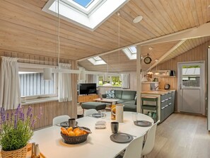 A cozy cabin with a dining area, kitchen, and a TV. - "Fliri" - 700m from the sea by Interhome (Hjørring)