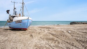 A fishing boat with the registration HM70 on a sandy beach. - "Asmo" - 350m from the sea by Interhome (Fjerritslev)