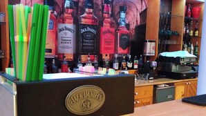 A bar area with a Jack Daniel's display and various liquor bottles. - Hotel Styria (Chvalovice)