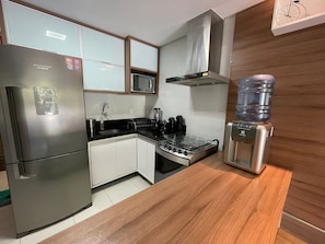 Apartment | Private kitchen | Fridge, microwave, blender, cookware/dishes/utensils