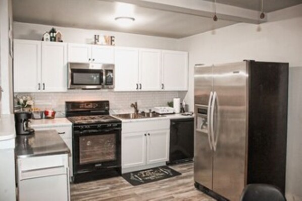 Enjoy cooking in this fully equipped kitchen with appliances and a convenient coffee maker.