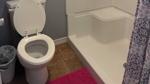 A bathroom with a toilet, a shower, and a bathtub. - Whiskey Bay Lodge #2 (Boothville-Venice)