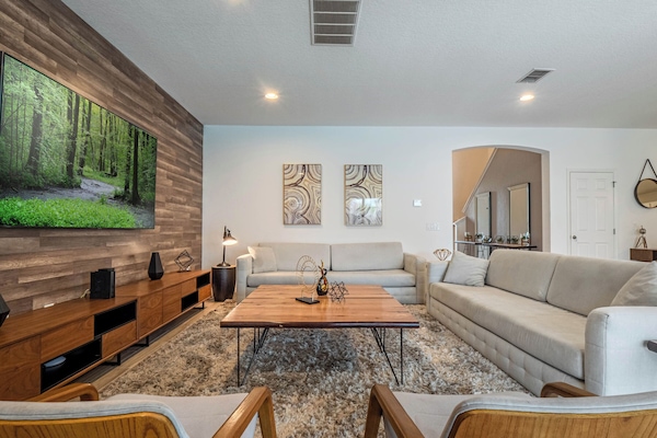 Spacious living area w/ pool views