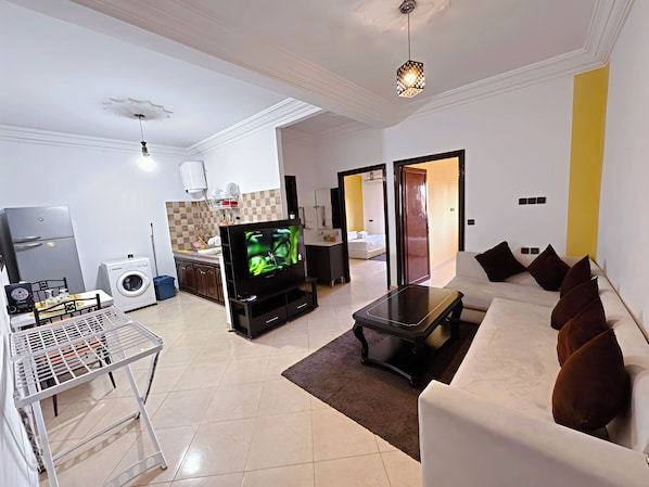 Appartement Deluxe | Coin séjour | Télévision à écran plat