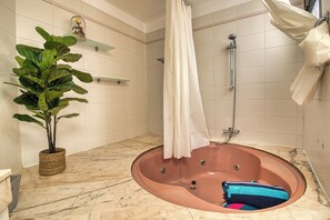Bathtub, hair dryer, towels