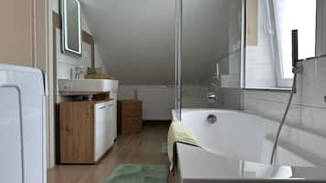 Bathtub, hair dryer, towels