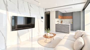 A modern living room with a flat-screen TV mounted on a marble wall, a round coffee table with a plant, and a large beige sofa.