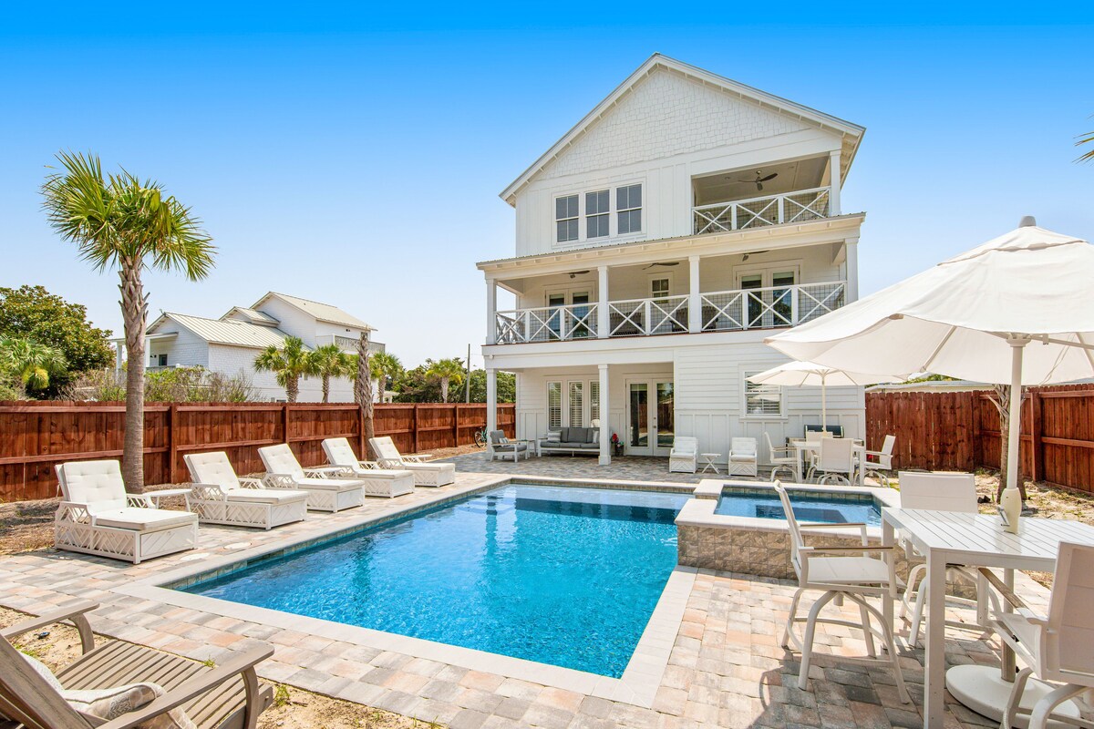 Incredible three-story home with a pool, pool spa, wet bars, AC, & washer/dryer