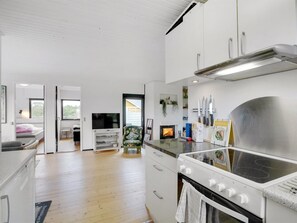 Fridge, dishwasher, highchair, cookware/dishes/utensils