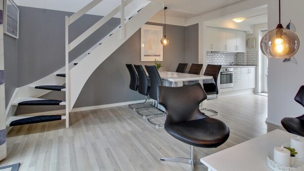 A modern interior with a staircase, dining area, kitchen, and pendant lighting. - "Raine" - 2.3km from the sea by Interhome (Rømø)
