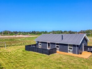 A modern two-story house with a dark exterior, large windows, and a sloped roof. - "Elenore" - 900m from the sea by Interhome (Løkken)