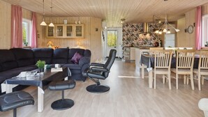 A modern interior with a living area, dining space, and kitchen. - "Letizia" - 700m from the sea by Interhome (Hals)