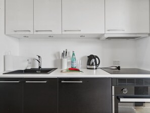 Fridge, oven, highchair, cookware/dishes/utensils