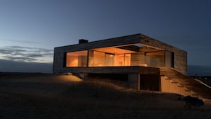 A modern house with large windows and a staircase leading to the entrance. - "Caterina" - 100m from the sea by Interhome (Blåvand)