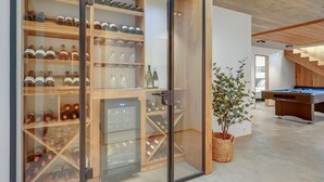 A modern interior with a wine cellar, a pool table, and a staircase. - "Caterina" - 100m from the sea by Interhome (Blåvand)