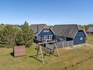 Enjoy a home away from home with a covered patio, swing set, and play structure.