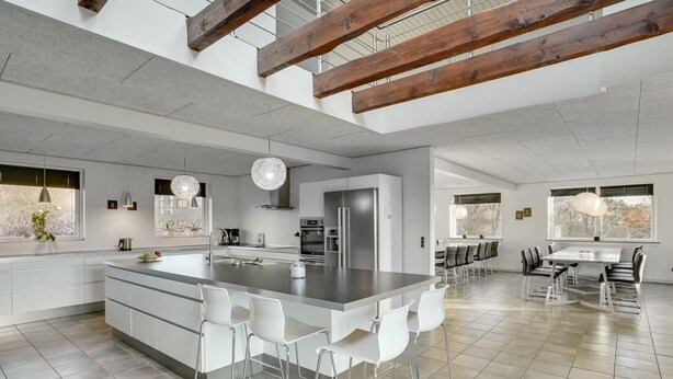 A spacious kitchen with a large island, modern appliances, and a dining area with a table and chairs. - "Markhild" - 300m to the fjord by Interhome (Hurup Thy)