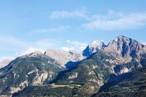 A mountainous landscape with rugged terrain and a valley.