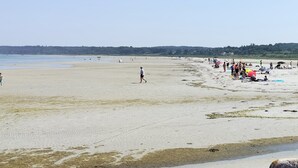 A wide sandy beach with people and beach umbrellas. - "Line" - 10m from the sea by Interhome (Glesborg)