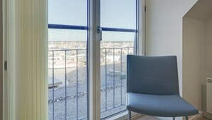 A room with a large window overlooking a marina with boats. - "Line" - 10m from the sea by Interhome (Glesborg)