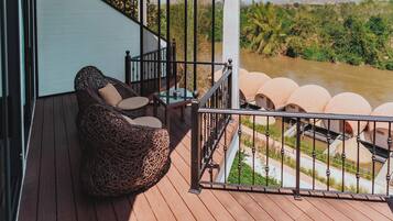 Deluxe Twin Room, River View | 1 bedroom, in-room safe, desk, blackout curtains