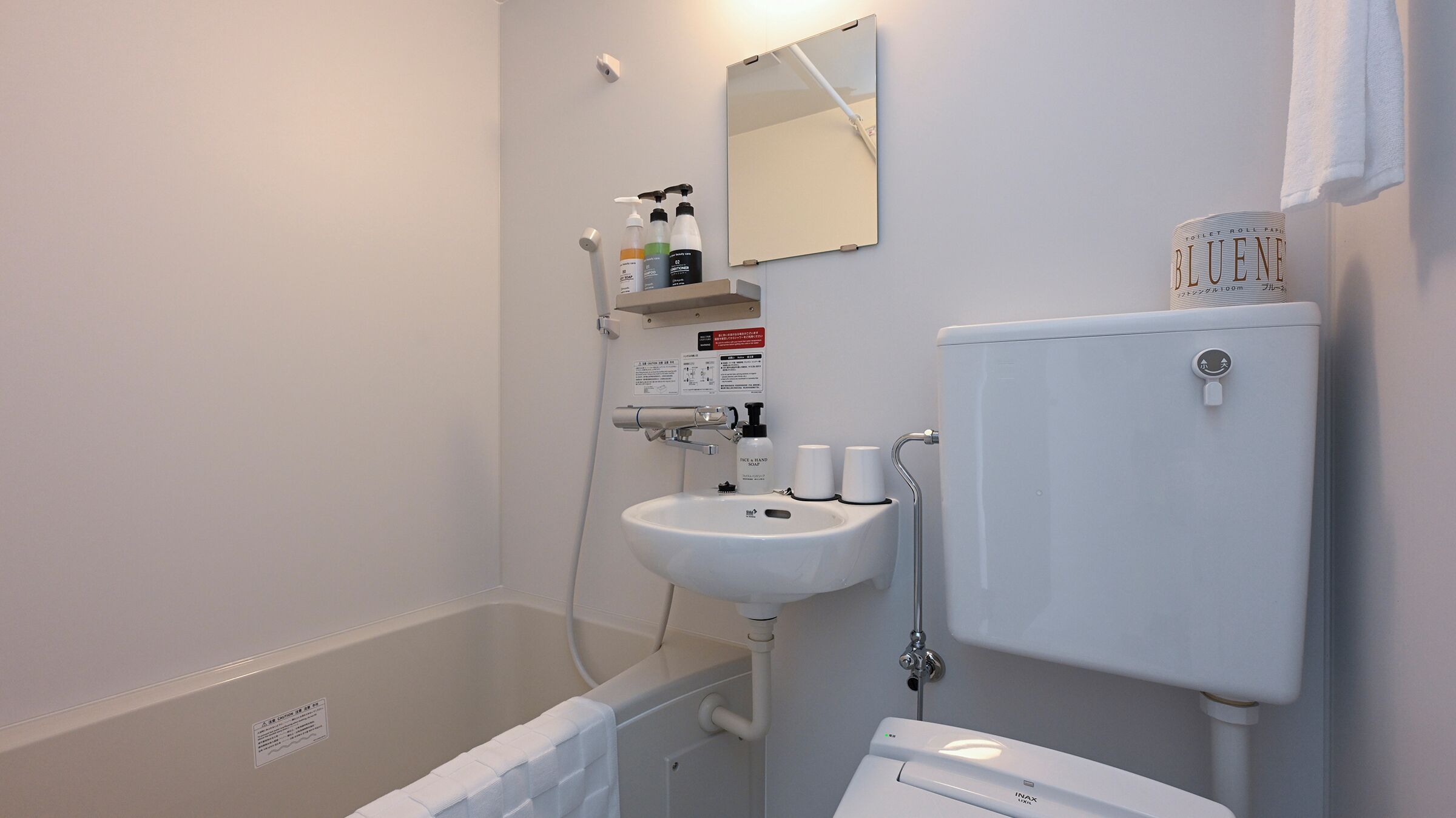 Combined shower/tub, free toiletries, hair dryer, slippers