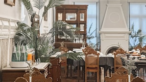 A formal dining room with ornate furniture, chandeliers, and a fireplace. - GRANDE HOTEL PARIS by STAY HOTELS (Porto)
