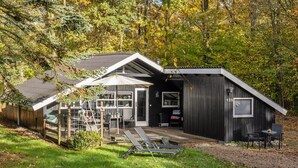 A modern house with a large patio area, a covered outdoor seating area, and a small garden. - "Elisabeta" - 28km from the sea by Interhome (Toftlund)
