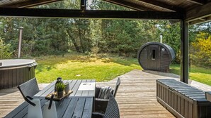 A covered outdoor area with a wooden deck, a hot tub, and a sauna. - "Eli" - 1.5km to the fjord by Interhome (Blåvand)